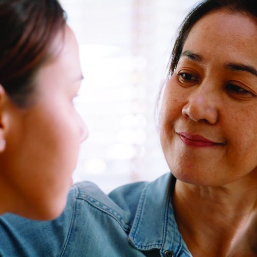 Middle aged asia people old mom love care trust comfort help young teen talk crying stress relief at home. Mum as friend listen adult child woman feel pain sad worry of broken heart life crisis issues